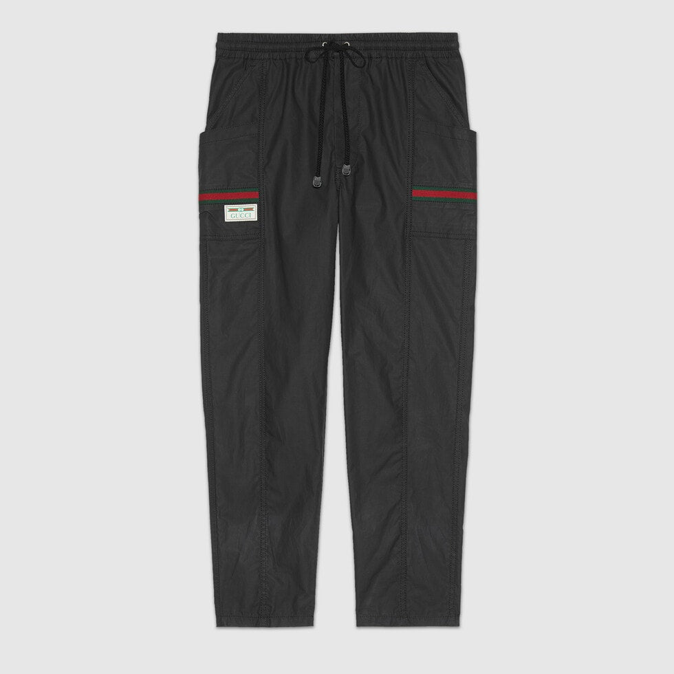 COATED COTTON TROUSERS WITH GUCCI LABEL