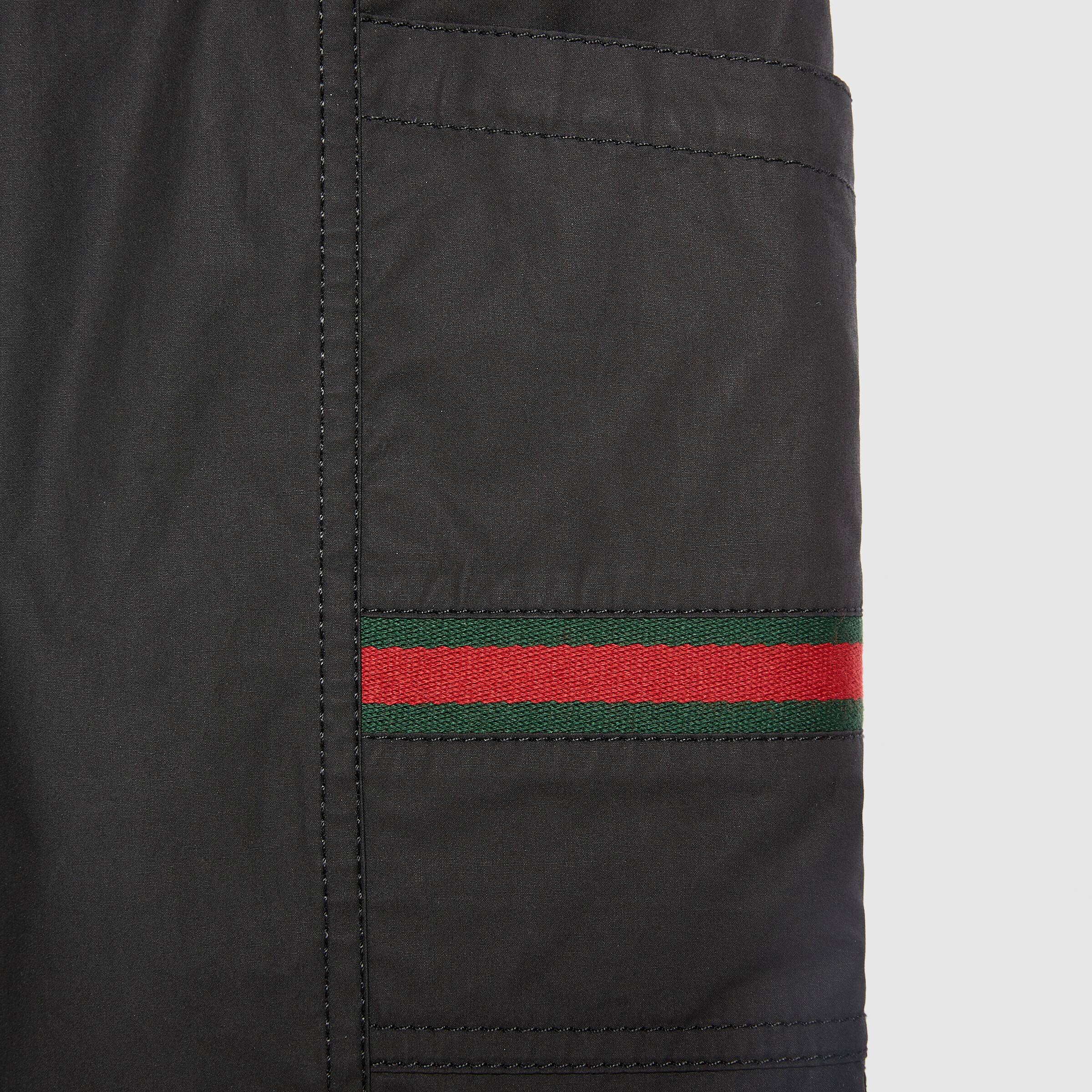 COATED COTTON SHORTS WITH GUCCI LABEL